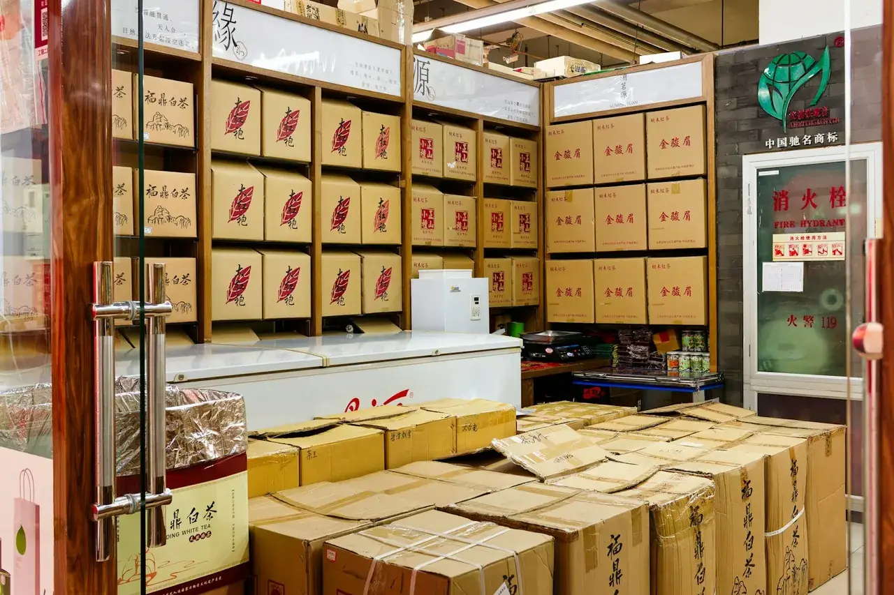 Busy e-commerce distribution warehouse with stacked packed boxes ready for festive season dispatch